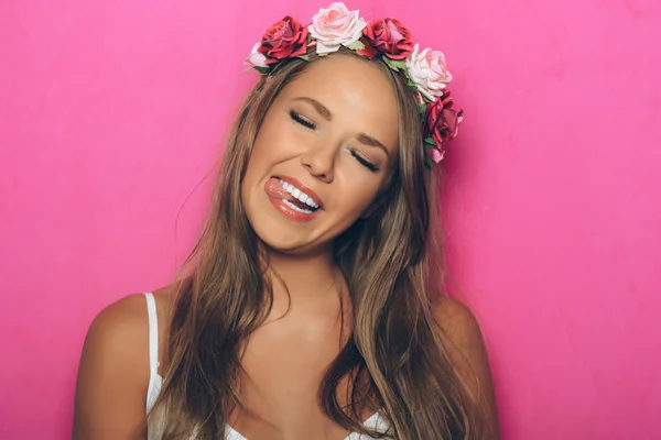 Young woman with flowers in her hair — Stock Photo, Image