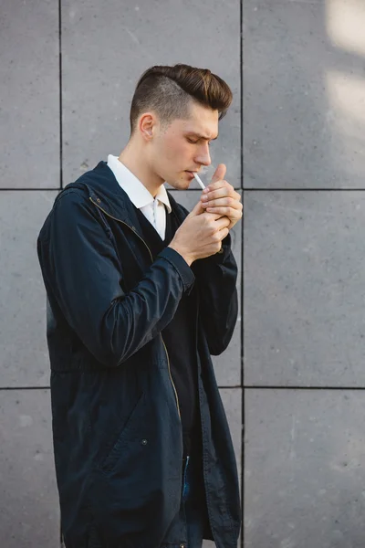 Fashion hipster male model smoking — Stock Photo, Image