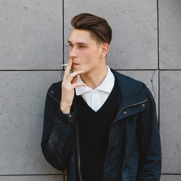 Fashion hipster male model smoking — Stock Photo, Image