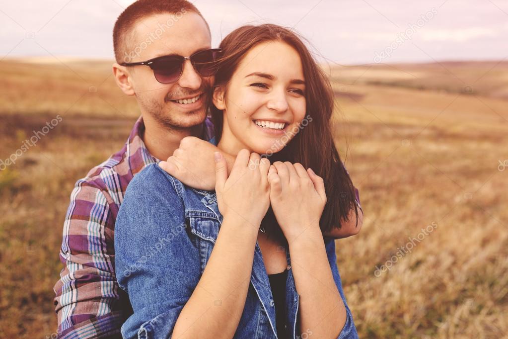 Landscape portrait of young beautiful stylish couple sensual and