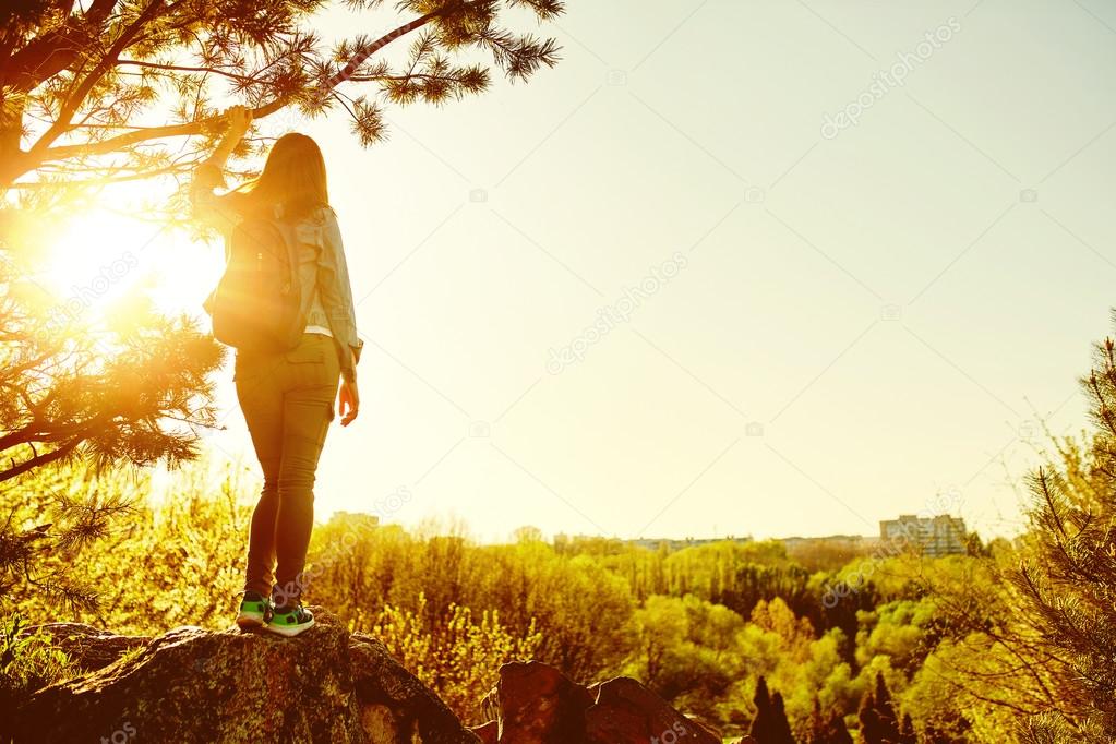 Woman mountain hiker with backpack enjoy view