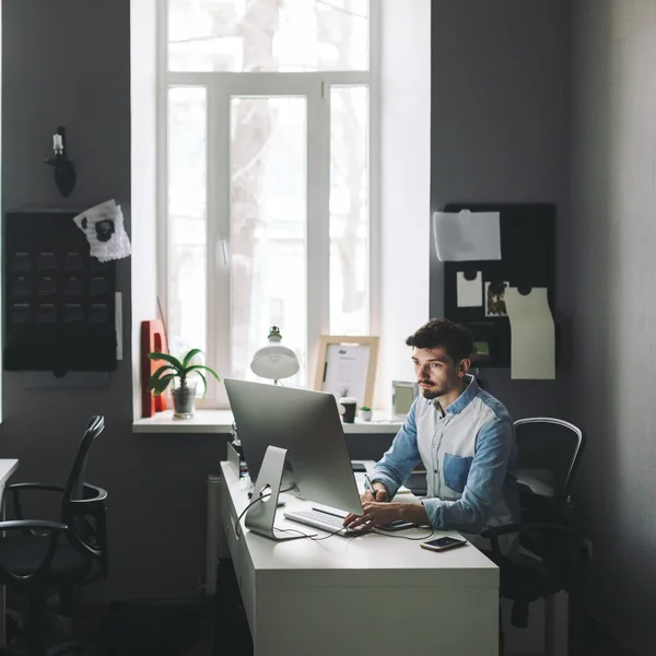 Young graphic designer working in office — Stock Photo, Image