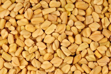 Fenugreek seeds macro as food nature background clipart