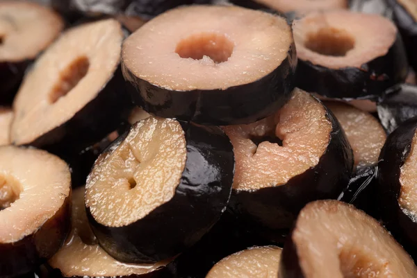 Rings black sliced olives background. — Stock Photo, Image