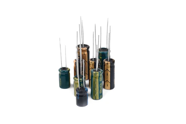 Electrolytic Capacitors green, black, yellow isolated on white — стоковое фото