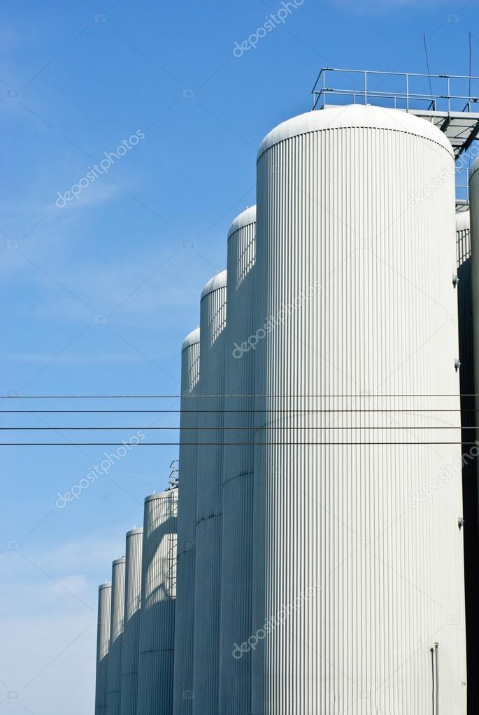 brewery tanks blue sky big containers beer production industry 