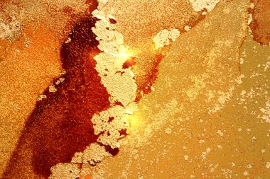 Amber, kırmızı ve altın parlayan soyut mermer arka plan