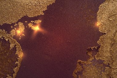 Dark gold and maroon abstract marble background with sparkles