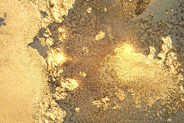 Светящийся серый и желтый мрамор с золотой пылью — стоковый вектор