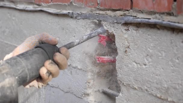 Construction work. Puncher making holes in concrete. — Stock Video