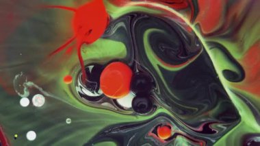 Renkli kabarcıklar. Siyah arka planda soyut kırmızı, sarı, yeşil karışımı. Sanatsal renk arkaplanı.