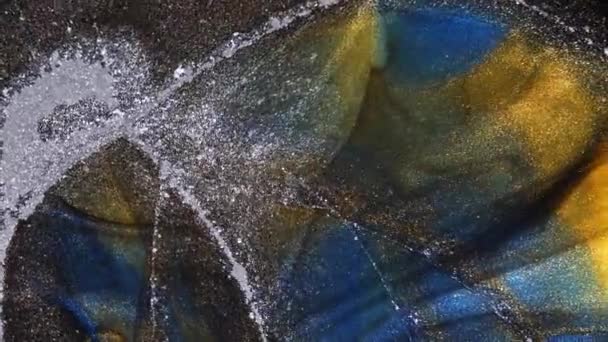 Fluid art. Black background with blue and gold stripes. Moving particles. — Stock Video