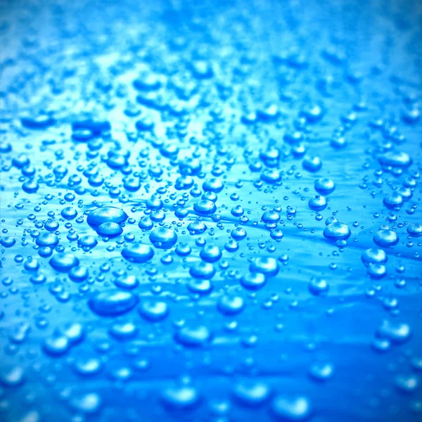 Blue drops on surface — Stock Photo, Image