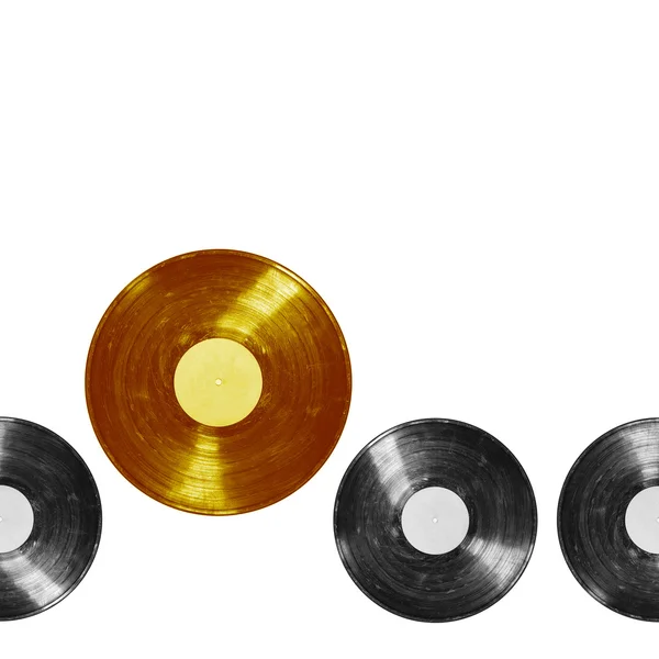 Gold vinyl record among ordinary — Stock Photo, Image