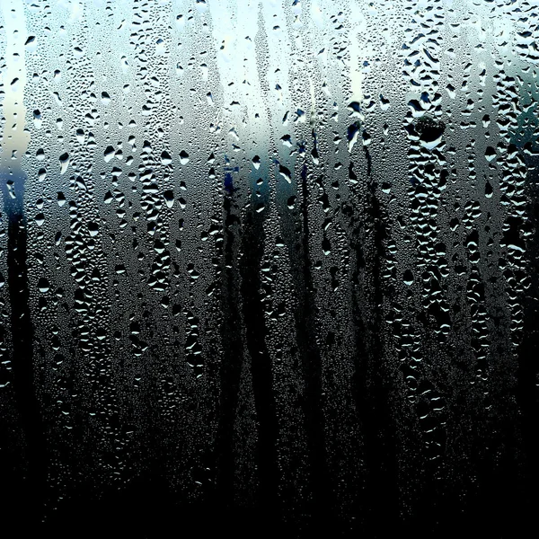 Beneveld venster, textuur drops, natte venster — Stockfoto