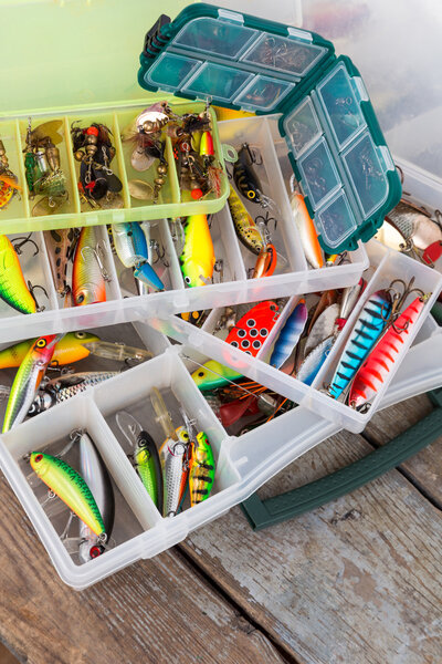 fishing lures and baits in boxes