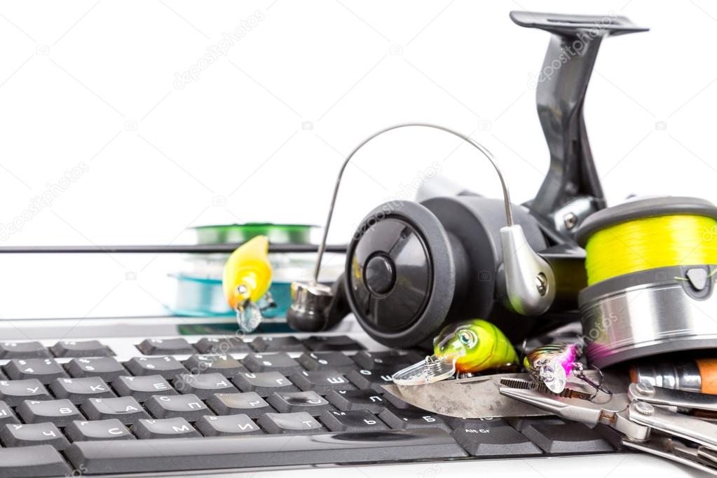 fishing tackles on computer keyboard