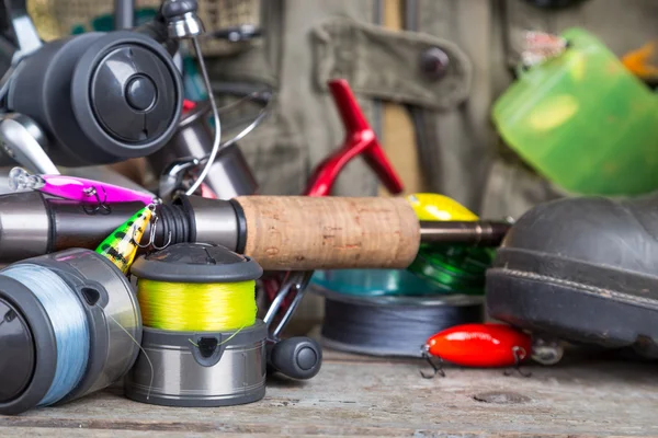 Fishing tackles with fishing vest and boots — Stock Photo, Image