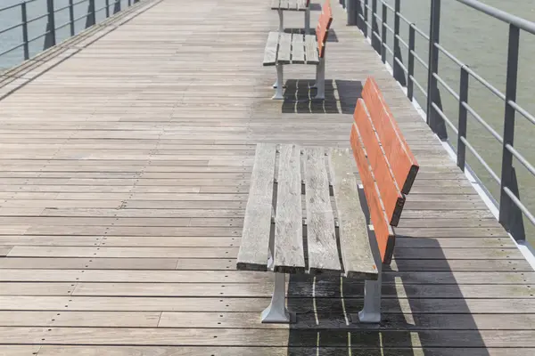 Empty wooden bench on footbridge — Stock Photo, Image