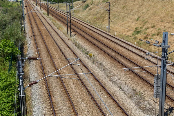 Empty railroad with posts and wires — Stock Photo, Image