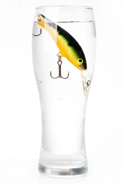 Fishing bait wobbler in glass with water — Stock Photo, Image