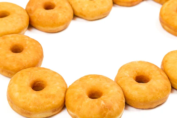 Gebratene runde Krapfen im Rahmen — Stockfoto