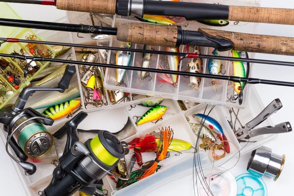 Fishing tackles - rod, reel, line and lures in box — Stock Photo, Image