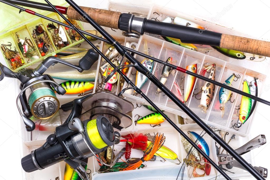 fishing tackles - rod, reel, line and lures in box