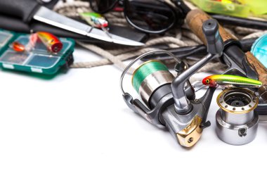 fishing tackles and anchor with cord on white