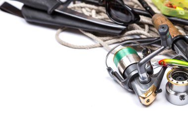 fishing tackles and anchor with cord on white