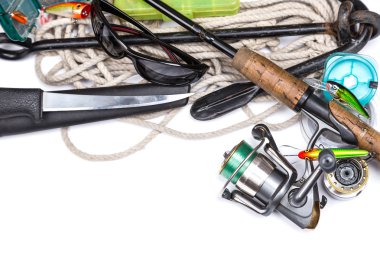fishing tackles and anchor with cord on white