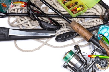 fishing tackles and anchor with cord on white