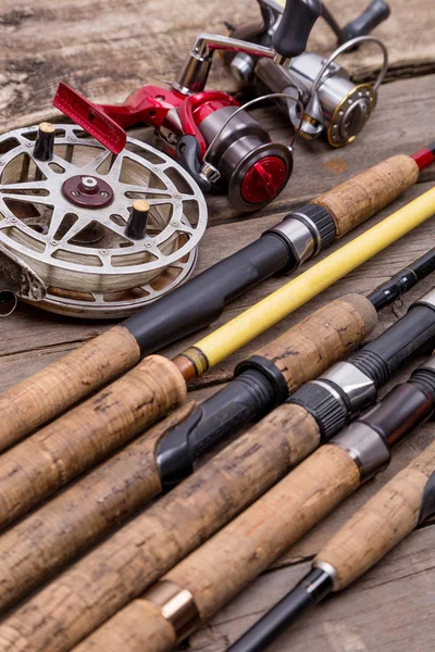 stock image fishing rods and reels on wooden boards