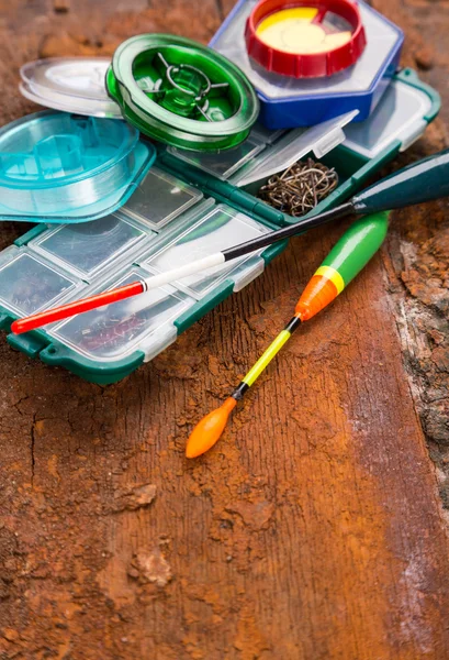 Fishing tackles for anglers on wooden background — Stock Photo, Image