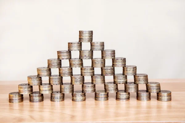 pyramid of the coins on the table