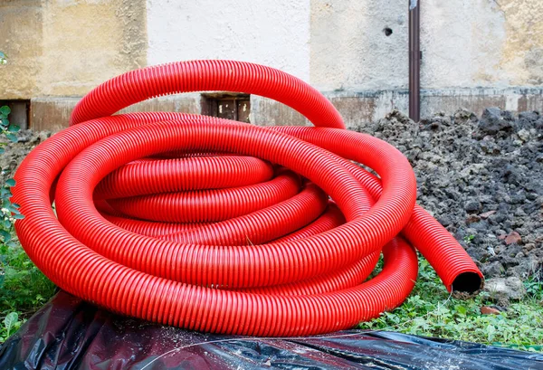 Roll Red Plastic Pipe Prepared Laying Lies Yard Summer Day — Stock Photo, Image