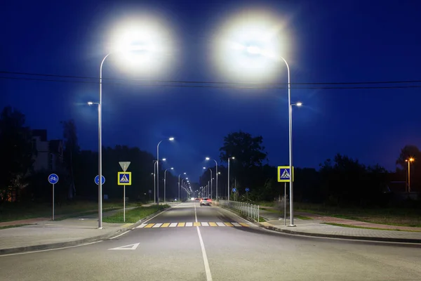 empty brightly lit new modern motorway at night