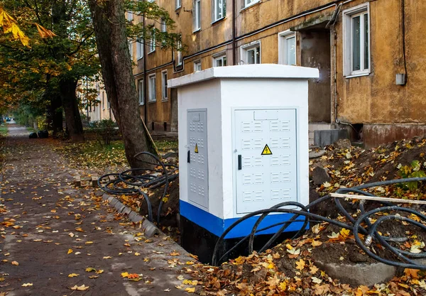 new modern metal transformer box on city street