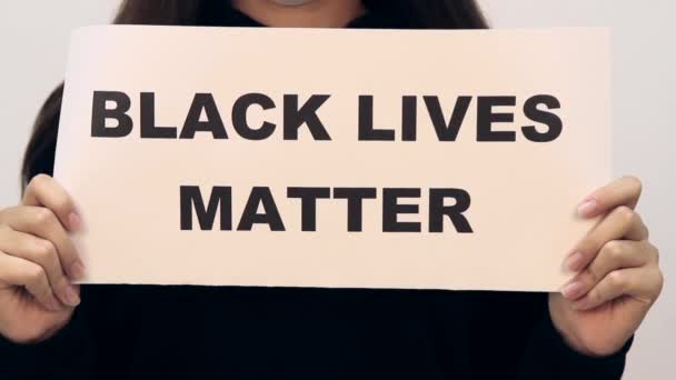 Brunette Teen Girl Protective Mask Holding Poster All Lives Matter — Stock Video