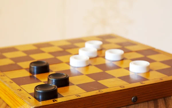 Black and white checkers on a chess board — Stock Photo, Image