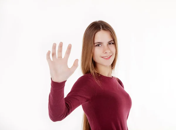 Jovem menina bonita segurando uma placa imaginária — Fotografia de Stock