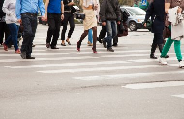 legs of pedestrians on a pedestrian crossing clipart