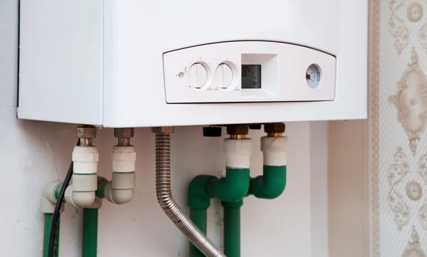 White boiler on the wall — Stock Photo, Image