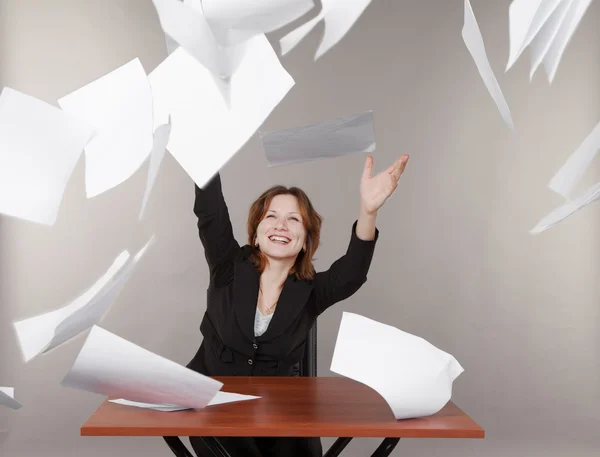 Business woman throwing up documents — Stock Photo, Image