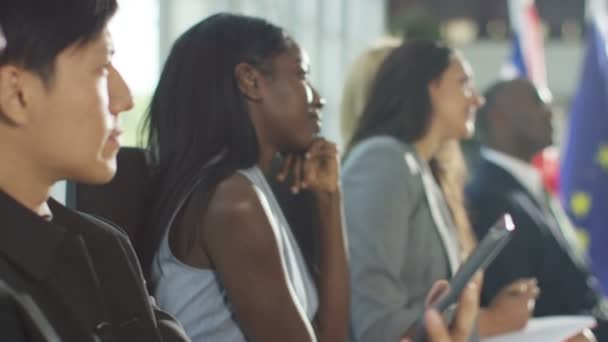 Group listening to the speaker at conference — Stock Video