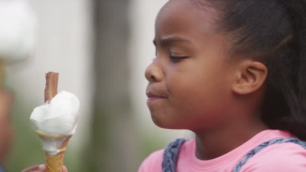 Girl enjoying an ice cream — Stock Video