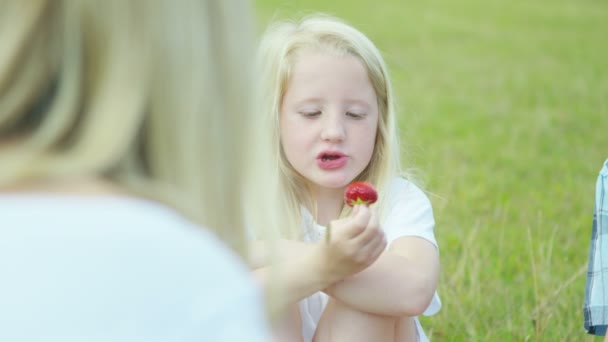 Mother eating  freshly picked fruits — Stock Video