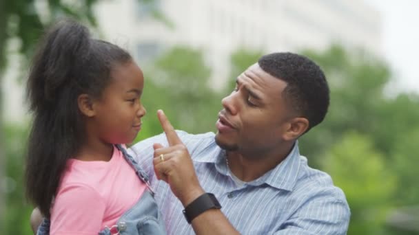 Father and daughter having fun in the park — Stock Video