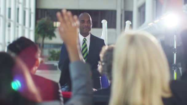 Group listening to the speaker at conference — Stock Video