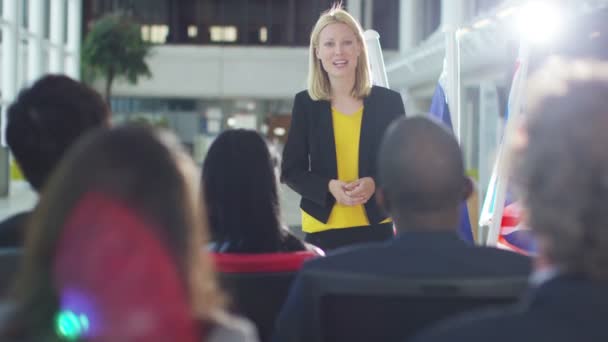 Group listening to the speaker at conference — Stock Video